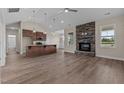 Spacious living room with a stone fireplace and hardwood floors at 152 Hillwood Dr, Sanford, NC 27332