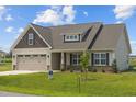 House exterior with neutral colors and a two-car garage at 58 Hillwood Dr, Sanford, NC 27332