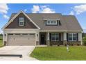 House exterior with neutral colors and a two-car garage at 58 Hillwood Dr, Sanford, NC 27332