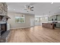 Spacious living room with fireplace and kitchen view at 147 Hillwood Dr, Sanford, NC 27332