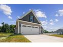 Two-car garage with gray and beige siding at 50 Oleander Ln, Sanford, NC 27332