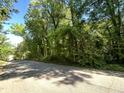 Wooded vacant lot with road frontage at 5308 Parkwood Dr, Raleigh, NC 27612