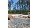 New home construction, foundation work in progress with gravel base at 700 Heathered Farm Way, Apex, NC 27523