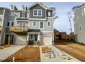 Modern 3-story townhome with attached garage and deck at 127 Sugar Run Dr # 27, Fuquay Varina, NC 27526