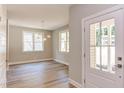 Bright dining room features hardwood floors, neutral walls, and an elegant light fixture at 206 Cardinal Ct, Oxford, NC 27565