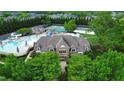 Aerial view of a community clubhouse near pools and tennis courts at 161 Blair Grove Ct, Burlington, NC 27215