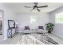 Bright living room with gray chairs and a large area rug at 1875 Cedar Creek Rd, Franklinton, NC 27525