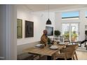 Casual dining area with a wooden table and access to a private patio at 106 Broadway St # 101, Durham, NC 27701