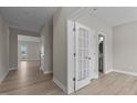 Bright hallway with light flooring, leading to other rooms at 545 Husketh Rd, Youngsville, NC 27596