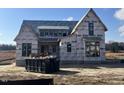 Two-story house under construction, featuring a large front yard at 4905 Hidden Pasture Way, Zebulon, NC 27597