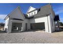 White two-story house with a side view of the garage at 4909 Hidden Pasture Way, Zebulon, NC 27597