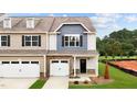 Two-story townhome with two-car garage and landscaped yard at 816 Pryor St # 54, Mebane, NC 27302
