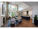 Open living room with high ceilings, fireplace and kitchen views at 4213 Burlington Mills Rd, Wake Forest, NC 27587