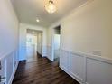 Bright entryway with hardwood floors and wainscoting at 117 Ausban Rdg Ln # 034, Four Oaks, NC 27524