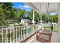 Relaxing front porch swing overlooking a peaceful street at 221 Southerby Dr, Garner, NC 27529