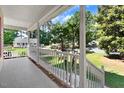 Front porch with white railings and view of the neighborhood at 221 Southerby Dr, Garner, NC 27529