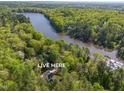Aerial view of house near a lake at 1817 N Lakeshore Dr, Chapel Hill, NC 27514