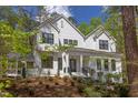 Beautiful farmhouse exterior with landscaping at 1817 N Lakeshore Dr, Chapel Hill, NC 27514