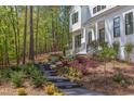 Stunning home exterior with landscaped walkway leading to the front entrance at 1817 N Lakeshore Dr, Chapel Hill, NC 27514