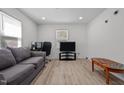 Cozy living room featuring a gray couch and a coffee table at 221 Stroud St, Sanford, NC 27330