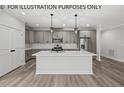 Modern kitchen with gray cabinets, island, and stainless steel appliances at 210 Lilliput Ln, Wake Forest, NC 27587