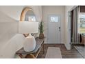 Bright entryway with decorative mirror and table, showcasing stylish home decor at 7652 Michelle Rd, Rocky Mount, NC 27803