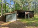 Rustic barn with corrugated metal siding and ample storage space at 3721 Brightwood Ln, Durham, NC 27703
