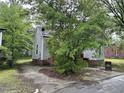 Gray house with red brick foundation and driveway at 529 Dexter St, Rocky Mount, NC 27803