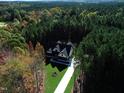 Aerial view of a house nestled in a wooded area at 40 Harvest View Way, Franklinton, NC 27525