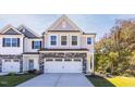 Townhouse exterior with two-car garage at 69 Fairwinds Dr, Lillington, NC 27546