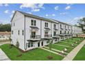 Row of townhouses with landscaping and street view at 349 E Fourth St # 1, Wendell, NC 27591