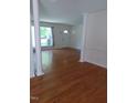 Hardwood floors and white columns in living room at 511 Normandy St, Cary, NC 27511