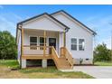 Gray siding one-story house with a front porch at 709 Tillman St, Burlington, NC 27217