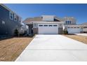 Modern craftsman style home with stone accents and a two-car garage at 231 Village Walk Dr, Clayton, NC 27527