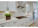White kitchen with stainless steel appliances and herringbone backsplash at 154 Swain St, Clayton, NC 27527