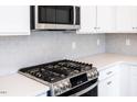 Stainless steel gas cooktop and microwave at 161 Charlie Cir, Angier, NC 27501