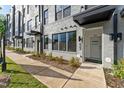 Modern townhome exterior with walkway and landscaping at 102 Ailey Brook Way # 100, Wake Forest, NC 27587