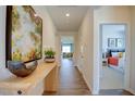 Bright entry hall with hardwood floors, showcasing a view to the living area and bedroom at 1223 Middlecrest Dr, Rocky Mount, NC 27804