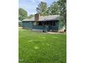 Green house with a large backyard and deck at 7253 Hunt Valley Trl, Wendell, NC 27591