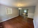 Dining room with hardwood floors and built-in shelving at 1222 N Nc Hwy 54 W, Chapel Hill, NC 27516