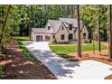 Aerial view showcasing the house, driveway, and surrounding trees at 503 Damascus Church Rd, Chapel Hill, NC 27516