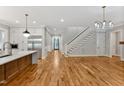 Modern kitchen with hardwood floors, stainless steel appliances, and an island at 503 Damascus Church Rd, Chapel Hill, NC 27516