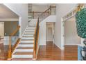 Two-story entryway with hardwood floors and staircase at 1329 Endgame Ct, Wake Forest, NC 27587