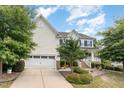 Two-story house with driveway and landscaping at 1329 Endgame Ct, Wake Forest, NC 27587