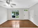 Living room featuring hardwood floors and backyard access at 320 Gilman Ln # 110, Raleigh, NC 27610