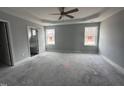 Bright main bedroom with ceiling fan and en-suite bathroom access at 106 Burnello Ct, Princeton, NC 27569