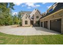 Brick home with three-car garage and large driveway at 109 November Dr, Durham, NC 27712