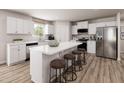 Modern kitchen with white cabinets, stainless steel appliances, and an island at 136 Coble Farms Pl, Fuquay Varina, NC 27526