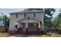 Two-story home with a porch and deck at 209 Freeman St, Raleigh, NC 27610