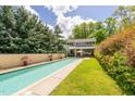 Inviting swimming pool with grassy area and home view at 617 Tower St, Raleigh, NC 27607